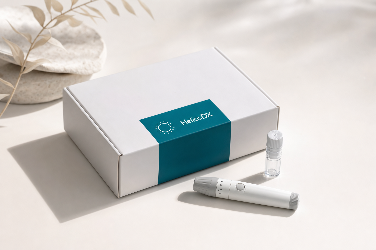 HeliosDX at-home blood collection kit on a clean studio surface